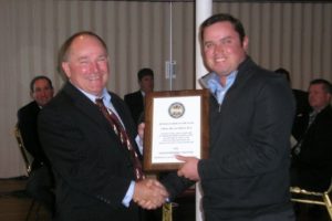 Craig Junior Leader Picture Craig McLaughlin, Candia Woods Head Golf Professional accepting the New Hampshire Chapter Junior Leader of the Year award from NHC President Ken Hamel.