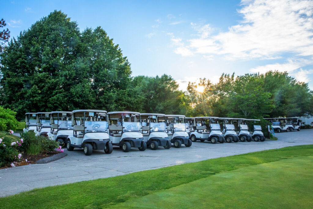 Golf carts lined up for an outing at Candia Woods