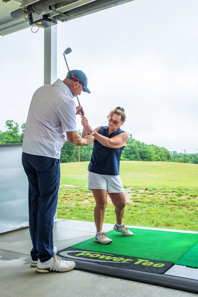 Golf instructor giving a lesson at The Oaks